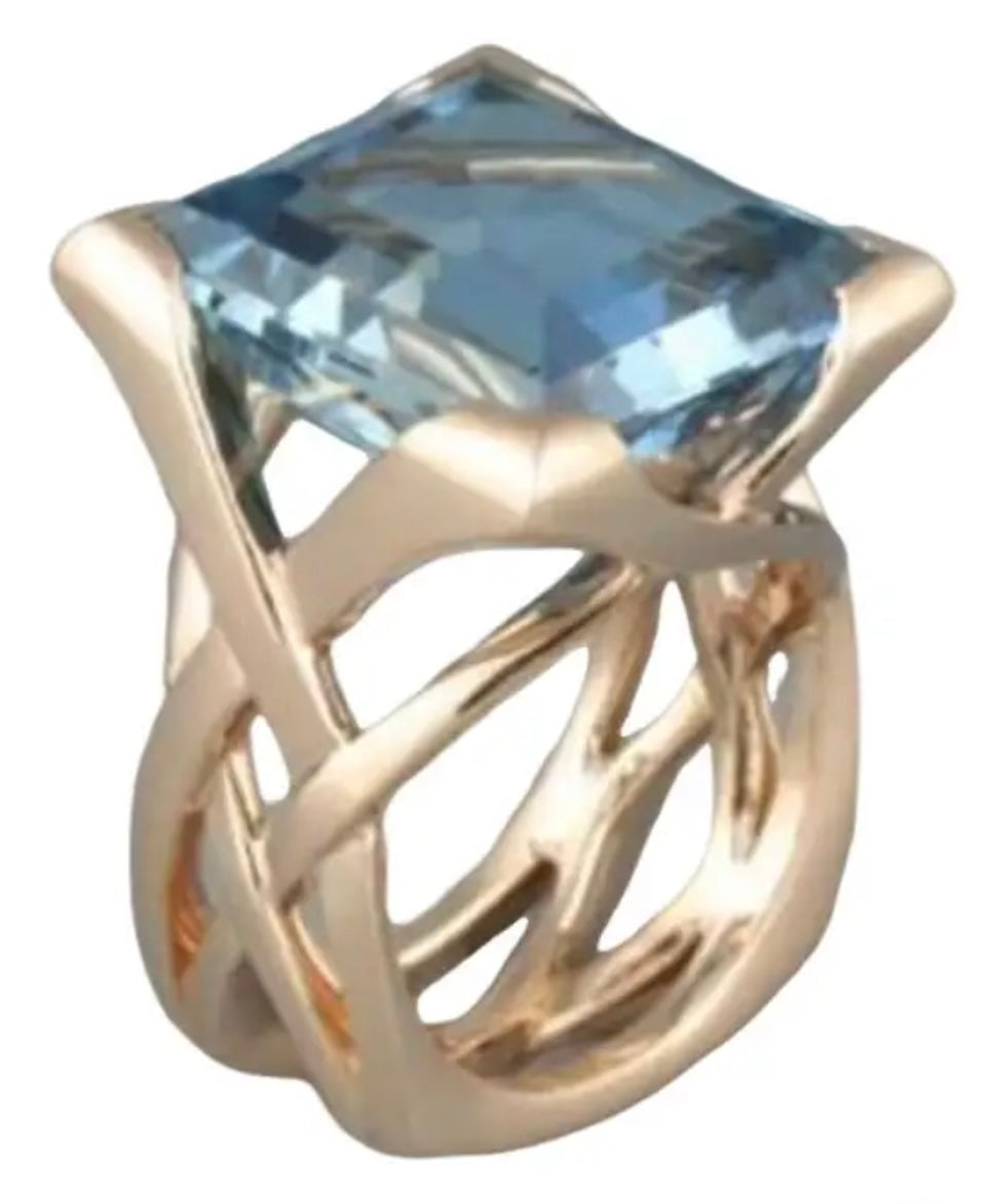 The Ava – Gold Statement Ring with Sky Blue Faceted Gemstone